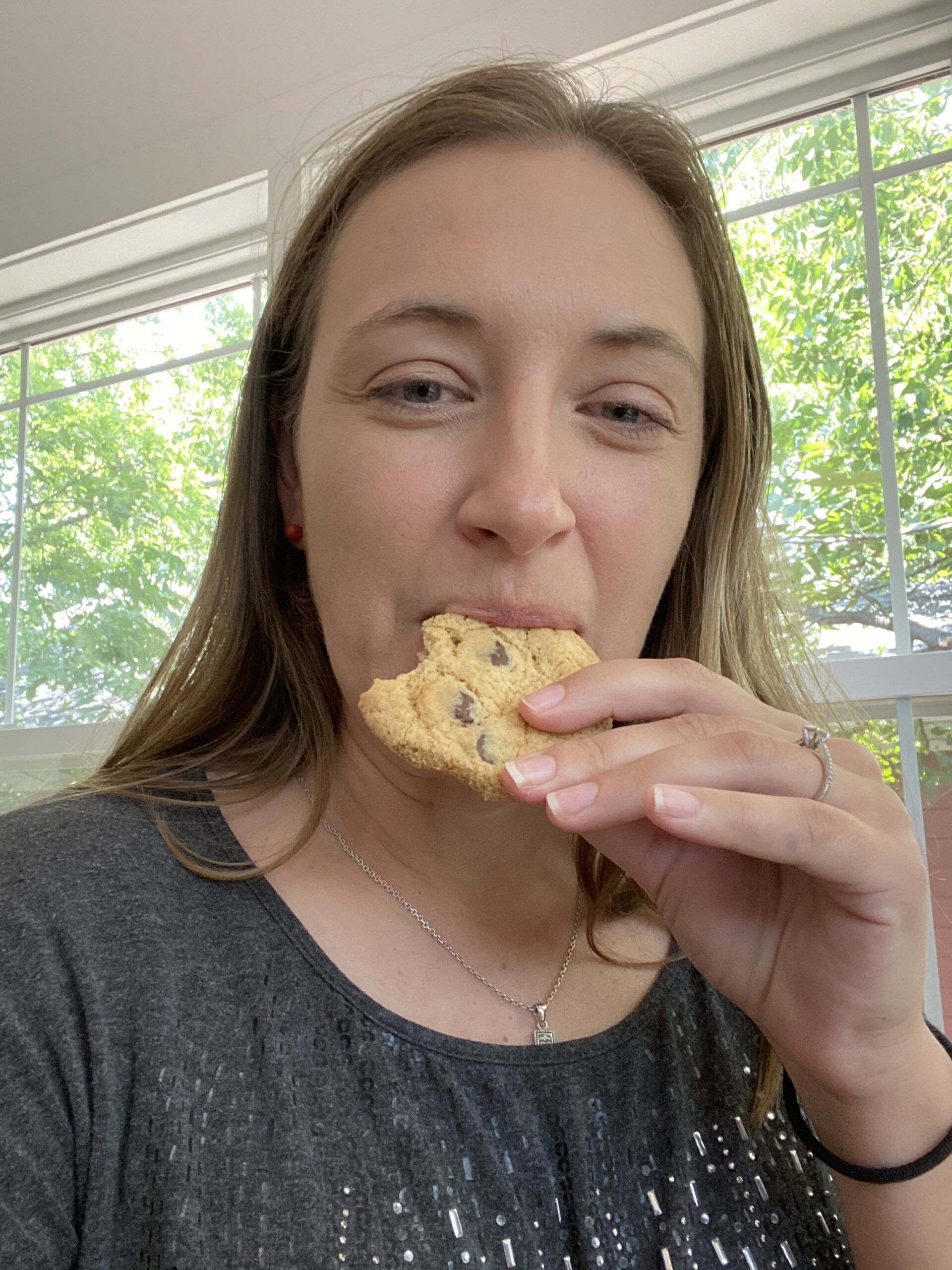Amber eating a chocolate chip cookie