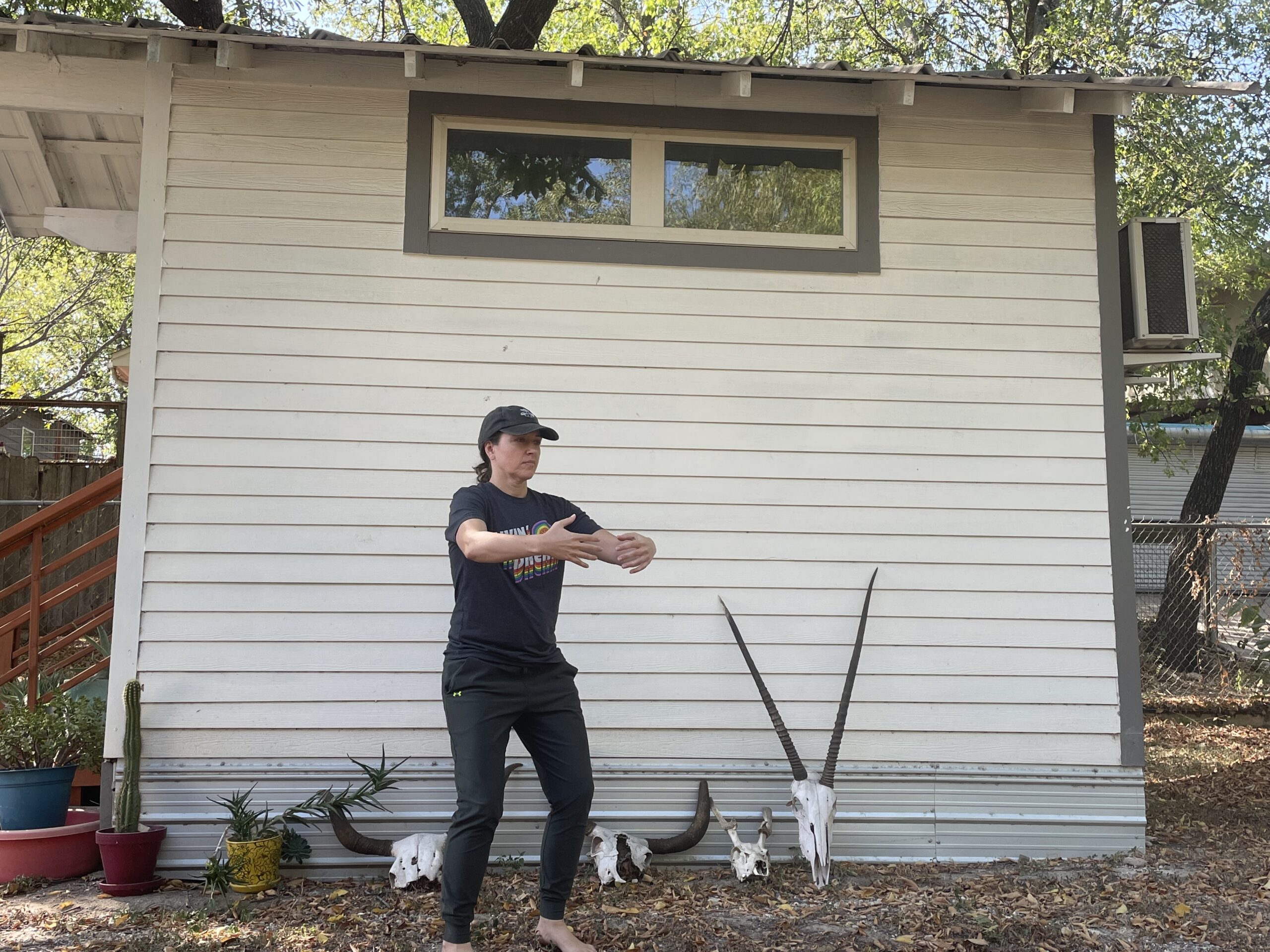 Amber holding the Embracing the Tree qigong stance