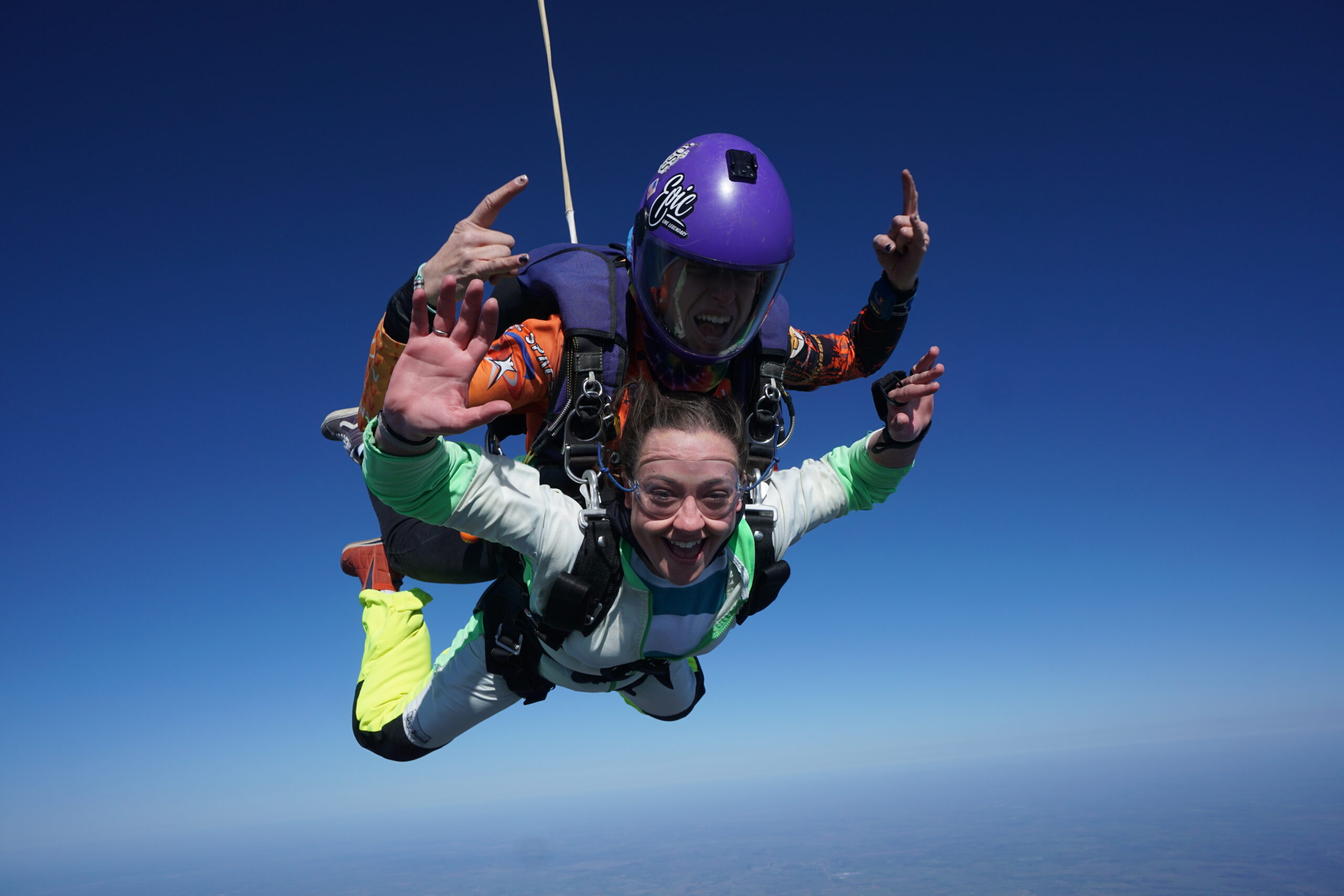 Amber and her tandem skydiving partner, mid air