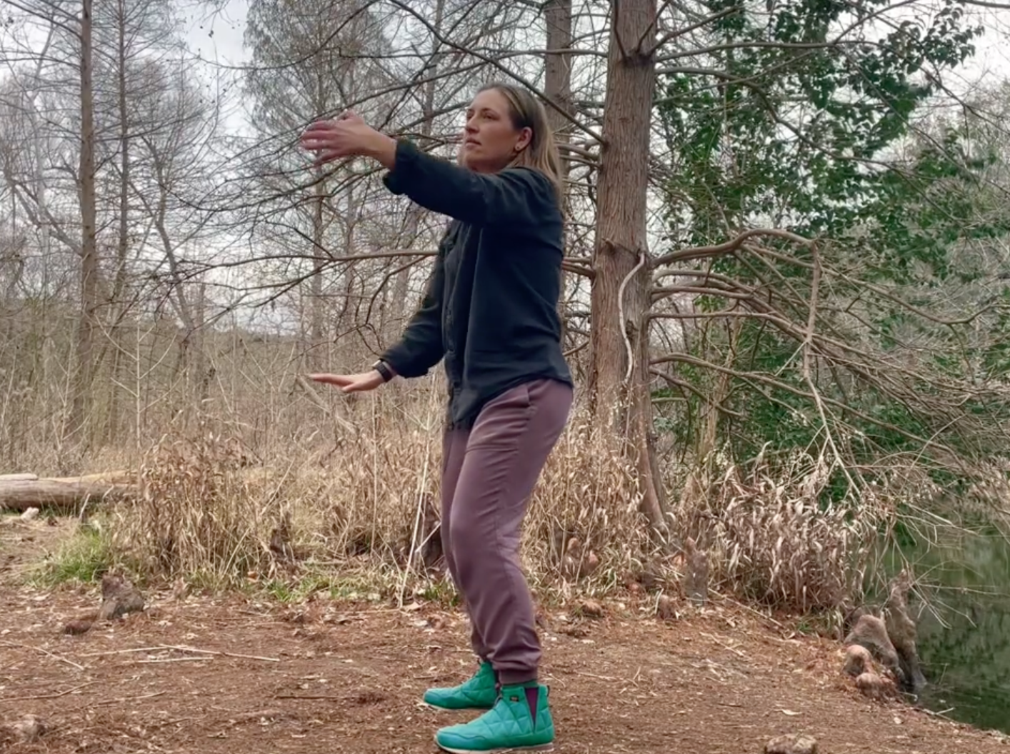 Amber doing Cloudy Hands qigong movement